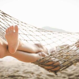 Relaxing at the beach in a hammock