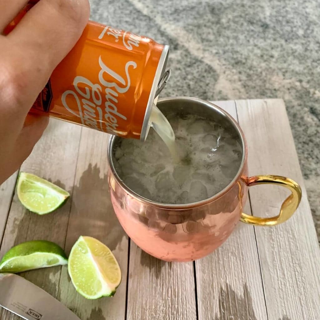 pouring ginger beer for moscow mule