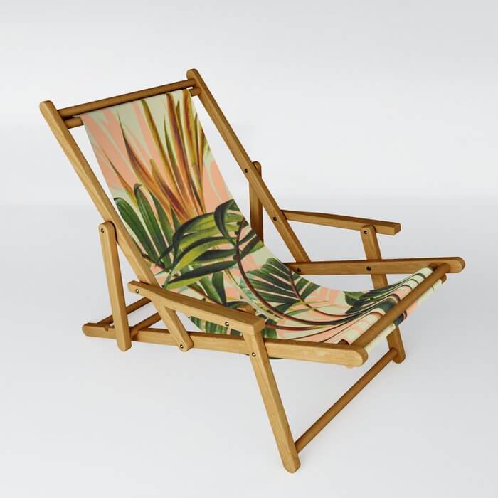 Mom can relax in this tropical printed  sling style beach chair
