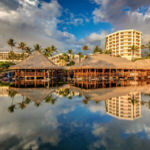 the grand wailea hotel in maui reflecting on the water